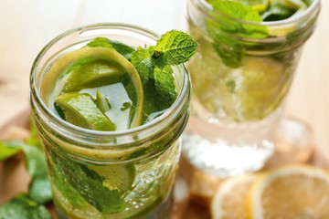 Jar of fresh mojito on table, closeup