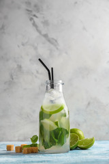 Bottle of fresh mojito on light table