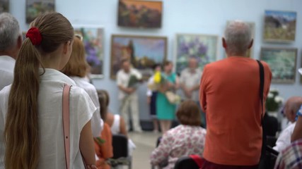 A vernissage. Private view. Opening of an Exhibition of Paintings