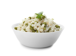 Bowl with tasty boiled rice and peas on white background