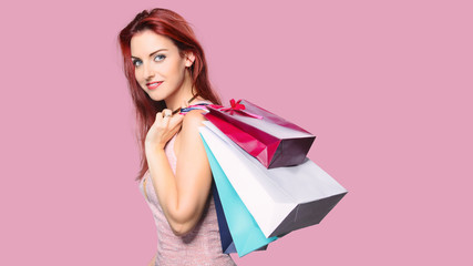 Redhead women with shopping bags