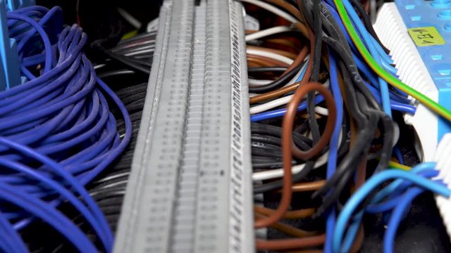 4K slider shot of wires of an programmable logic controller
