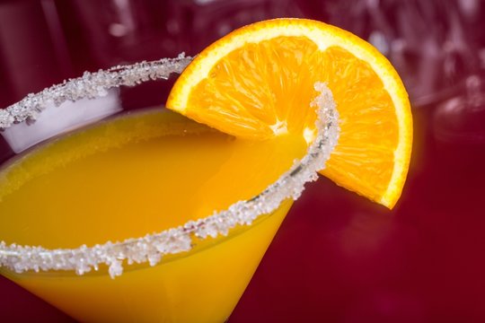 Yellow Cocktail With Orange Garnish