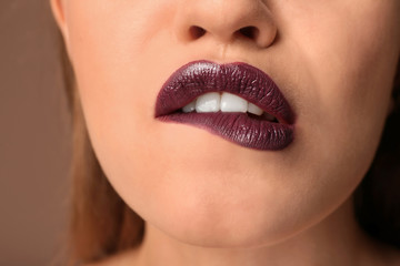 Fototapeta premium Beautiful young woman with dark lipstick, closeup
