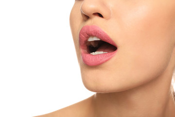 Beautiful young woman with pink lipstick on white background, closeup