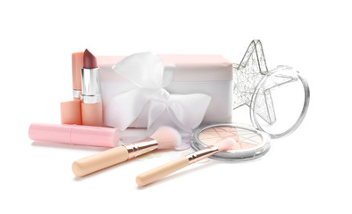 Set of decorative cosmetics with gift box on white background