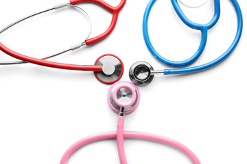 Medical stethoscopes on white background