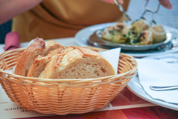 Sliced fresh bread (baguette) in a basket