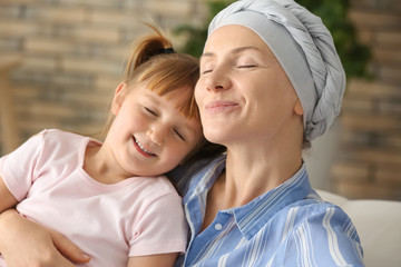 Little girl and her mother after chemotherapy at home