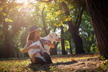 Girl and dog in park.