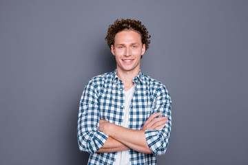 Cheerful nice attractive handsome young man with wavy hair in ca