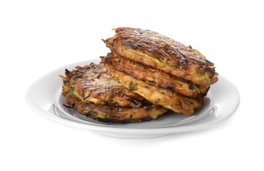 Plate with tasty zucchini pancakes on white background