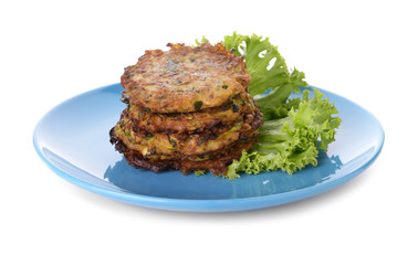 Plate with tasty zucchini pancakes on white background