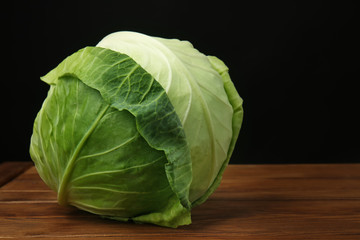 Fresh ripe cabbage on wooden table