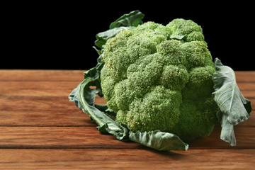 Fresh broccoli on wooden table