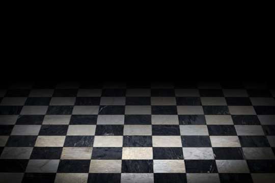 Antique checkered marble floor. Black and white tiled background with black top gradient and darkened vignette
