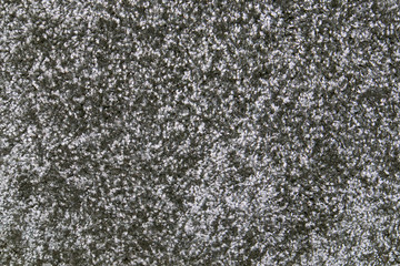 Grey synthetic short-napped floor carpet covering, may be used as background or texture