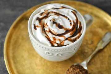Cup of delicious cocoa on tray, closeup