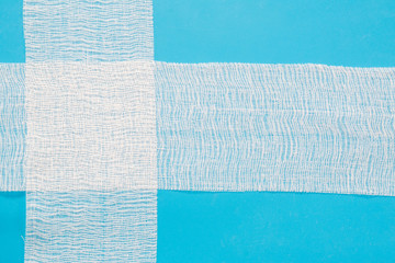 Fototapeta premium medical bandage on a blue background