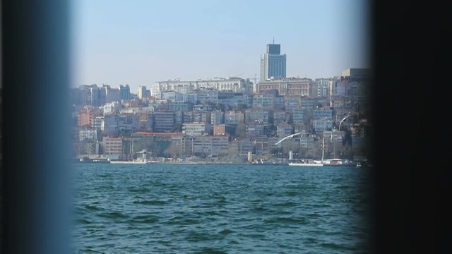 Beautiful cityscape of coastal city, overbuild coastline, pov of migrant worker