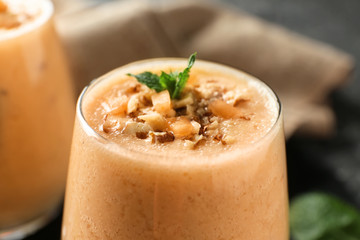 Glass of tasty melon smoothie, closeup