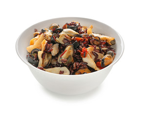 Bowl with tasty boiled rice and seafood on white background