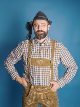 Beer Festival Oktoberfest.Man in traditional bavarian clothes Lederhose
