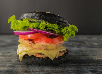 White and black hamburgers are served in different angles and with different fillings