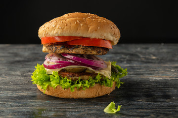 White and black hamburgers are served in different angles and with different fillings