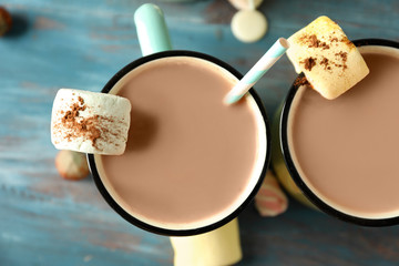 Cups of tasty cocoa with marshmallows, closeup