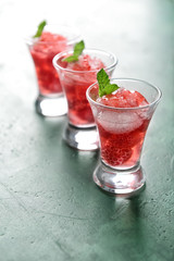 Fresh summer cocktail in shot glasses on table