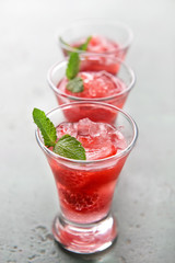 Fresh summer cocktail in shot glasses on table