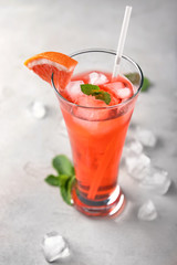Fresh summer cocktail in glass on light table