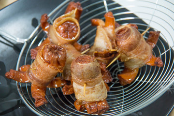  sausage wrapped in bacon