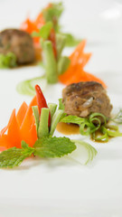 creative food design on white plate with spices and sauce