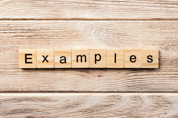 examples word written on wood block. examples text on table, concept