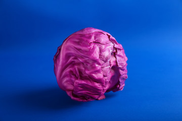 Fresh red cabbage on color background