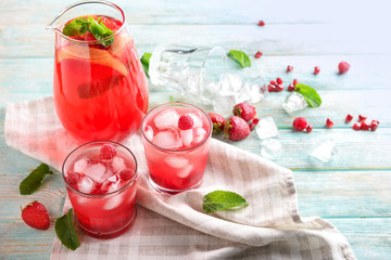 Fresh summer cocktail in glassware on wooden table