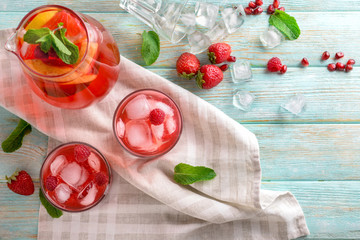 Fresh summer cocktail in glassware on wooden table