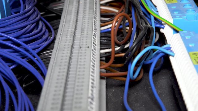4K slider shot of wires of an programmable logic controller