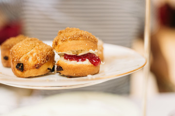 Scones with Strawberry Champagne Jam and Clotted Cream, Traditional English Tea Ceremony in Luxury Hotel