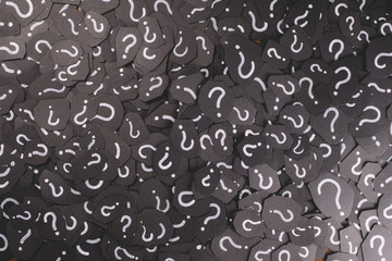 full frame image of black paper with QUESTION MARK for background. Concept of Question, Problem, FAQ, Q&A and mystery