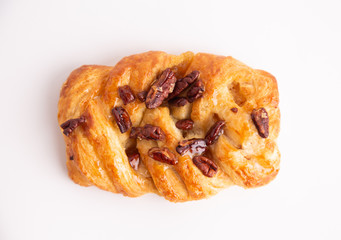 braid cake with nuts on white background