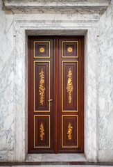beautiful wooden door in a marble house