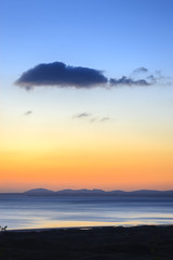Looking over the Llyn Peninsula and Isle of Anglesey Gwynedd Wales at sunset