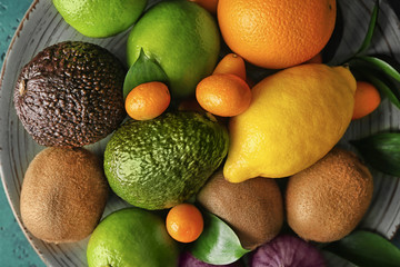 Plate with various delicious exotic fruits, closeup