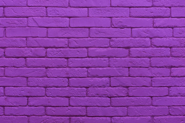 ultraviolet brick wall painted at saturated purple colour