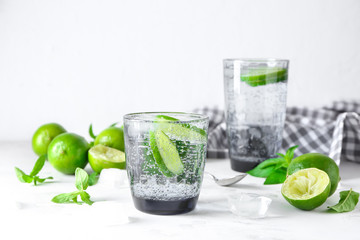 Glass of fresh lime lemonade on light table