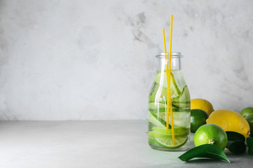 Bottle of fresh lime lemonade on light table