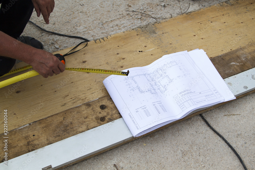 Poster customer construction of a country house verifies the workflow with the project documentation